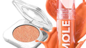 Kapağı açık MQLE Pure Pigment krem göz farı ve yanında bakır tonlu doku